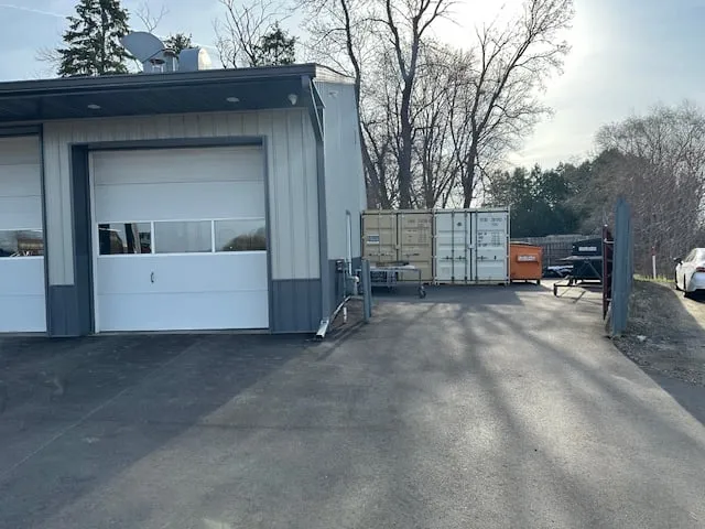 Service bay side of Loretto Auto Body at 49 N Medina Street, Loretto, MN 55357